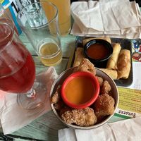 Cauliflower bites with hot sauce and spring rolls. Yum!  at Junk y Vegan in Helsinki