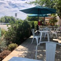 Outdoor seating with a mini library. 📚 at Copa Vida in San Diego