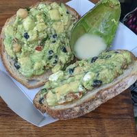 Avocado toast. We requested sauce on the side and they put it in an avocado shell. Nice zero waste hack. at Guaca Go in Boynton Beach