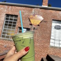 Oat milk matcha latte  at Curiosity Coffee Bar in Columbia