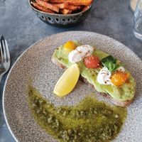 Avo on toast with some sweet potato fries on the side at Powerplant in North West London