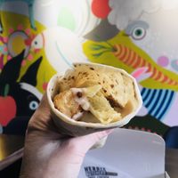 Cheesy egg chicken wrap. Bomb as hell 🔥  at Herbie Butcher's Fried Chicken in Minneapolis