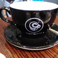 Teacup with logo (November 2024) at Coffee #1 in Aberystwyth