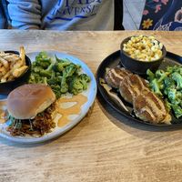 Nguru (pulled bbq sandwich made with oyster mushrooms), side of broccoli and fries; & Dagaa (“crab” cakes, side of Mac and cheese and broccoli)   at Michezo Vegan Cafe in South Orange