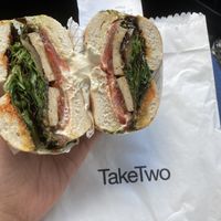 #7 Smoked tofu, charred Eggplant, vegan cream cheese, onion jam, harissa and leafy greens.   at Take Two in Brunswick East