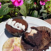 The Mostess Cupcake - best chocolate cupcake ever. Pictured with the Pistachio Rose shortbread cookie. at New Moon Vegan in Batavia