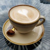 Cappuccino with oat milk at Café Geschwisterherzen in Krefeld