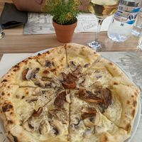 Mushroom pizza with vegan cream. at Artisti in Corfu