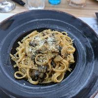 Mushroom linguine with vegan parmesan!! 10/10 at Artisti in Corfu