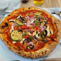 Vegan pizza with mixed vegetables and extra cheese at Artisti in Corfu