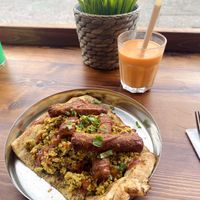 Vegan sausage and tofu naan, mango lassi  at Sabzi in Edinburgh