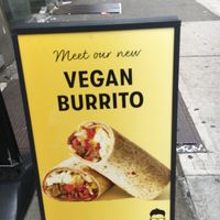 Placard advertising vegan burrito. at Gregory's Coffee - 6th Ave in New York City