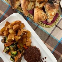 Vegan burger with potatoes and vegetables + italian pizza bread with garlic at Braavos in Banjole