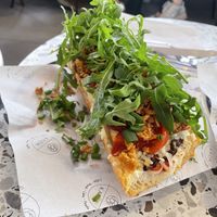 Vegan Zapiekanka: mushrooms spread, double vegan cheese, smoked tofu, cherry tomatoes, rucola  at Kazik in Amsterdam