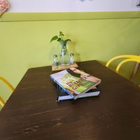 Books on tables at Lana's Healthy Bistro & Juice in San Juan