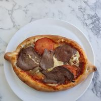 pizza with beef, served as vegan option, but is was BEEF 😳 at Pizzabutik Amigo in Arvika