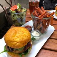 “Green Day Vegan” burger with sweet potato fries, homemade dips and salad 😋 at La Manufacture Gundeli in Basel