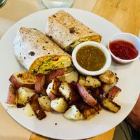 Breakfast tofu burrito with home fries  at Three Little Birds Cafe in Charleston