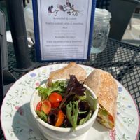 Vegan scramble burrito with vegan cheese and salad  at Three Little Birds Cafe in Charleston