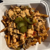 Loaded Goose Fries (philly style seitan, mushrooms, onions, peppers, jalapenos and nacho cheez) at The Grumpy Goose in Duluth