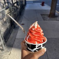 Regular cup with vanilla soft serve and strawberry syrup  at Vaca's Creamery in Chicago