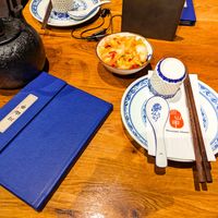 Tea and spicy cabbage that comes before you order at Szechuan Mountain House at Szechuan Mountain House in New York City