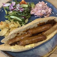 Vegan sausage and caramelised onion baguette with vegan coleslaw  at Tu Mundo Coffee in Prestatyn
