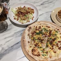 Pictured from left to right - espresso martini, caesar salad, carbonara pizza, mac & cheese at Purezza in Manchester