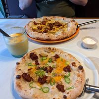 Large breakfast pizza and small Njuda pizza, not much difference in size at Purezza in Manchester