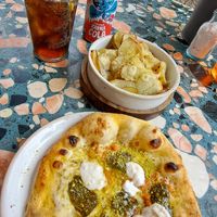 Pistachio pesto pizza and garlic potatoes at Purezza in Manchester