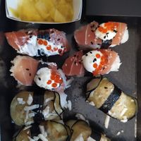 Vegan salmon and caviar and fried eggplant with vegan feta onigiris, with pickled mango stripes at Loco Sushi in Hamburg