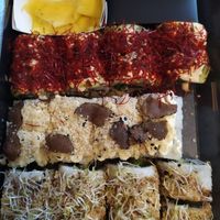 Variety of 3 sushi types with vegan fish and sauce toppings at Loco Sushi in Hamburg