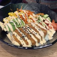 Chicken avocado bowl with sriracha sauce   at Vegan Temple Bar in Amsterdam