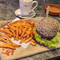 Losse frietjes met satay saus en truffle delight burger at Vegan Temple Bar in Amsterdam