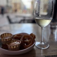 onion rings and pinot grigio  at Vegan Temple Bar in Amsterdam