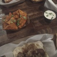 Italian sausage; brat, fries, loaded fries and deep-fried buffalo tofu with extra ranch at The Vanguard in Milwaukee