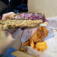Tempeh Reuben, sweet potato chips  at Laughing Seed Cafe in Asheville