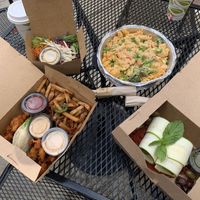 Buffalo cauliflower tacos and jalapeño onion fries with vegan chipotle ranch, house salad, vegan mac and cheese with broccoli, and spinach pesto manicotti😋🌱 at Laughing Seed Cafe in Asheville