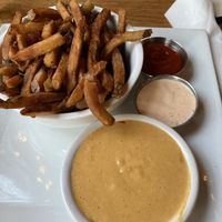Jalapeño onion fries, vegan queso and vegan chipotle sauce  at Laughing Seed Cafe in Asheville