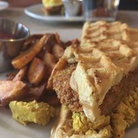 Chikn waffle sandwich made vegan with tofu scramble - amazing!!! at Laughing Seed Cafe in Asheville