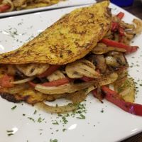 Vegan cachapa served with sauteed veggies at Arepitas in Round Rock