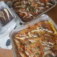 Our takeaway order. Aubergine tacos, Jackfruit tacos, loaded nachos, loaded fries. at La Neta in Preston