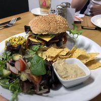 Seitan burger with vegan cheese at Govinda's Cardiff in Cardiff