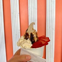 Malted vanilla base, mac nut, salted fudge, strawberries, whip cream  at Niu Soft Serve in Honolulu