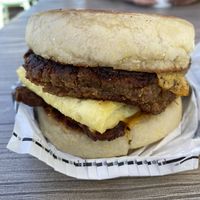 Bacon egg and cheese added sausage  at VEG'D in Costa Mesa