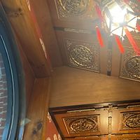 Dark wood, Chinese lanterns, and circular windows at Peking Chinese Restaurant in Wytheville