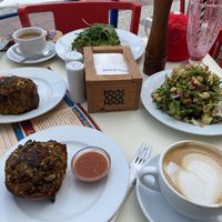 Vegan pumpkin bakes, avocado tostado with green tomatoes and rocket, and veganised salad; the smoothie didn’t last long enough to make the photo!   at Good Stuff Cafe in Nerja