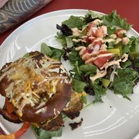 Homemade pretzel 🥨 bun sandwich and salad  at Off the Wheaten Path in Grande Prairie