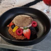 The desert of the high gin: chocolatemousse with pure chocolate on top, raspberry jam, forest fruits and a crumble on the side. at Beyond Lunchcafé & Patisserie in Nuenen