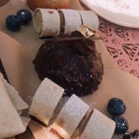 Banana chocolate ‘sushi’, peanut chocolate bites, a chocolate bombe with marmelade inside and a pear (?) cake. All vegan from their own patisserie   at Beyond Lunchcafé & Patisserie in Nuenen